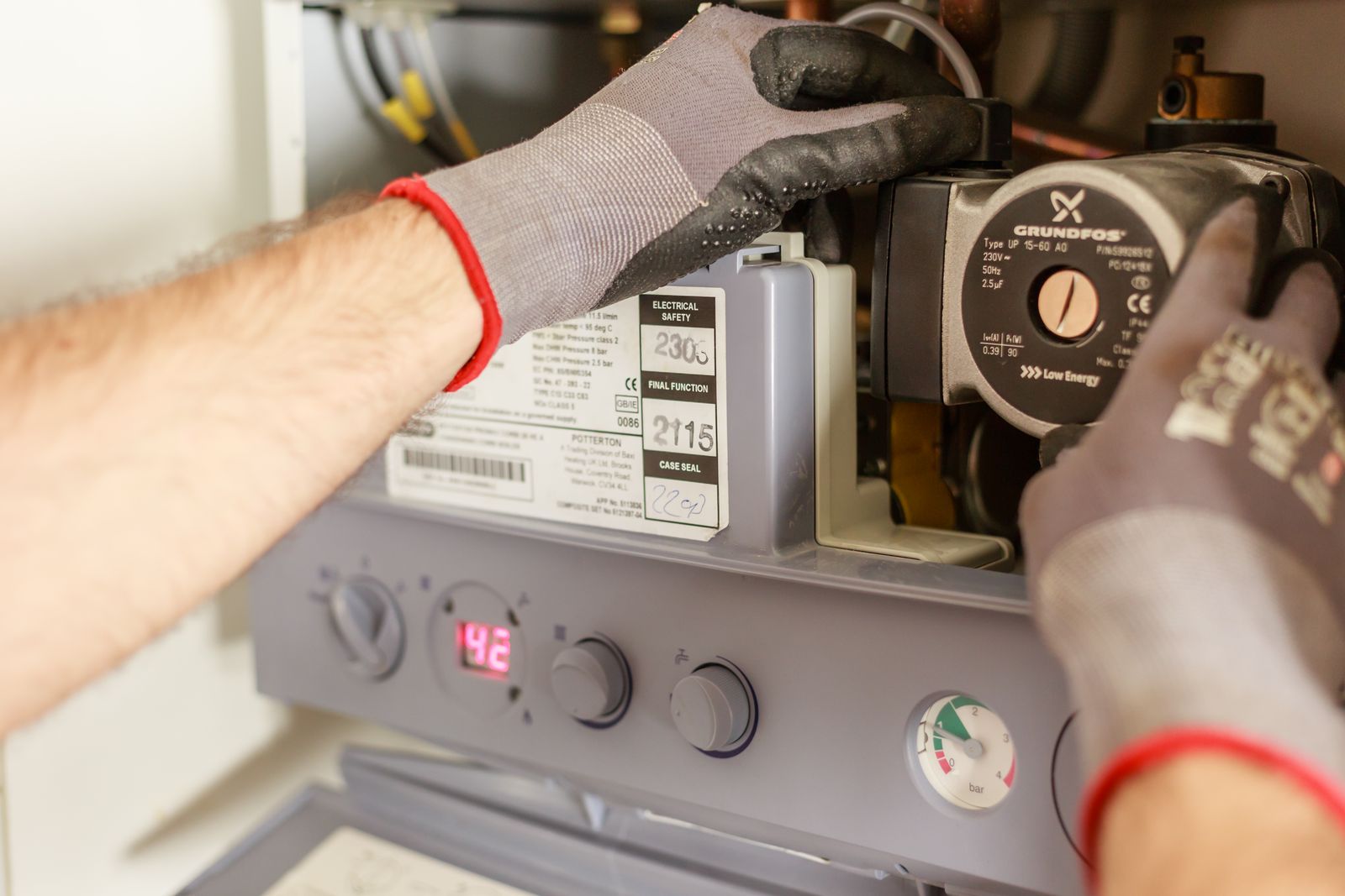 Technician servicing a heating system